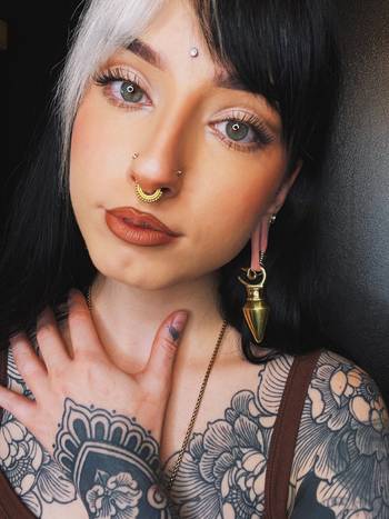 Tattooed Woman Wearing Brass Pyramid Ear Weights - Pair