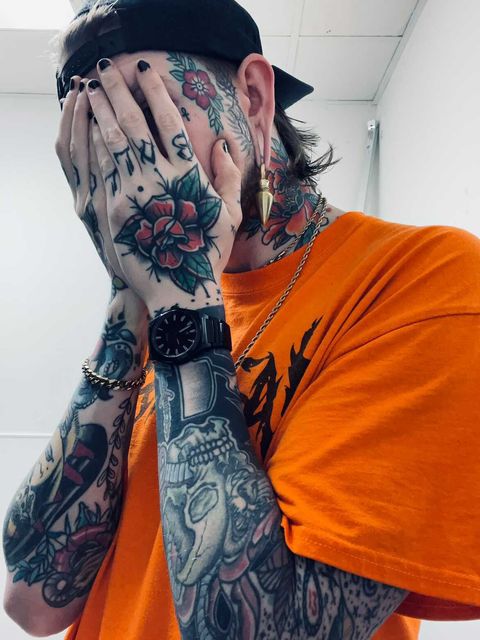 Tattooed guy wearing  Pyramid - Brass Ear Weights (Pair)