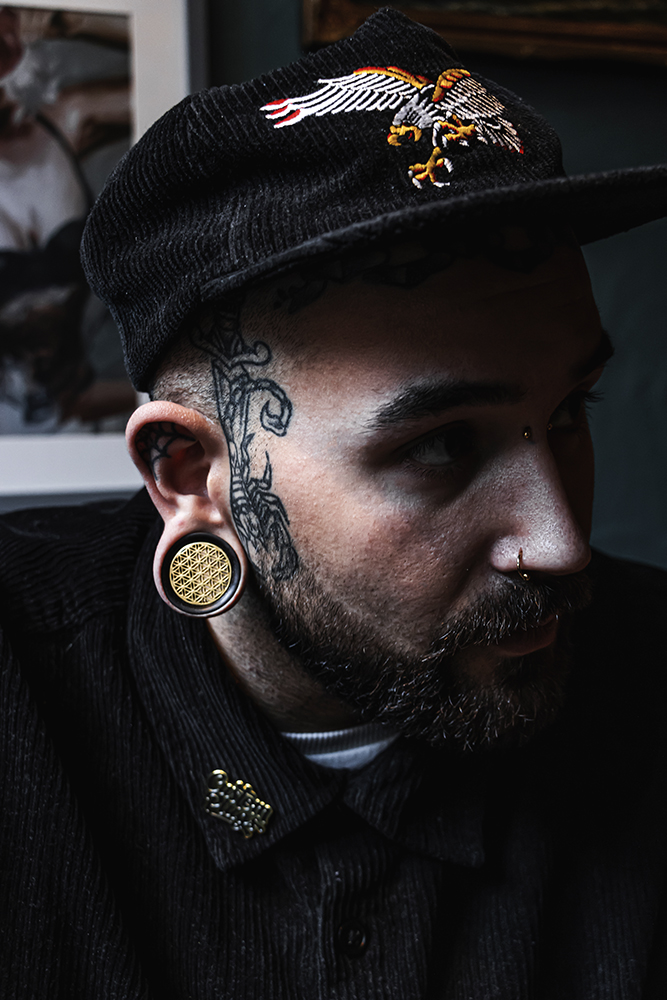 Guy wearing big Brass Flower Of Life  Wood Ear Plug / Gauge
