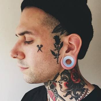 Male wearing large Opalite Glass Ear Tunnel