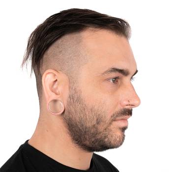 Male wearing large Clear Glass Plug / Gauge