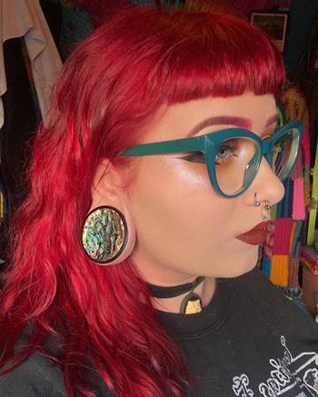 Girl wearing pretty Sono Abalone Wood Ear Plug / Gauge