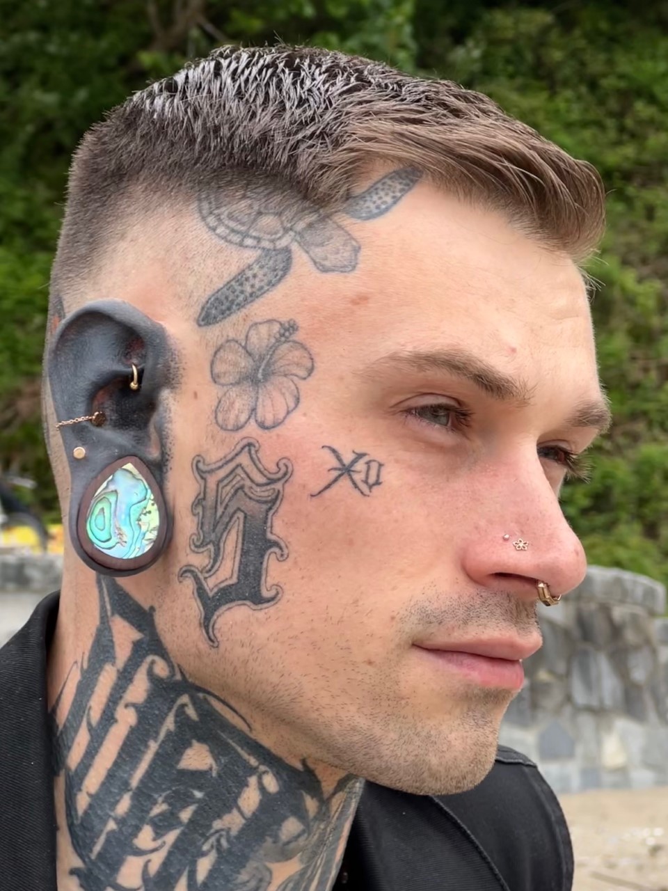Guy wearing cool Sono Teardrop Abalone Wood Ear Plug / Gauge