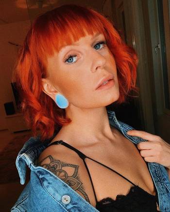 Women wearing large Teardrop Opalite Glass Plug / Gauge