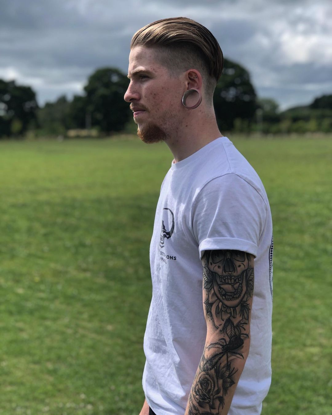 Guy wearing classy Silver Double Flared Stainless Steel Tunnel  / Plug / Gauge