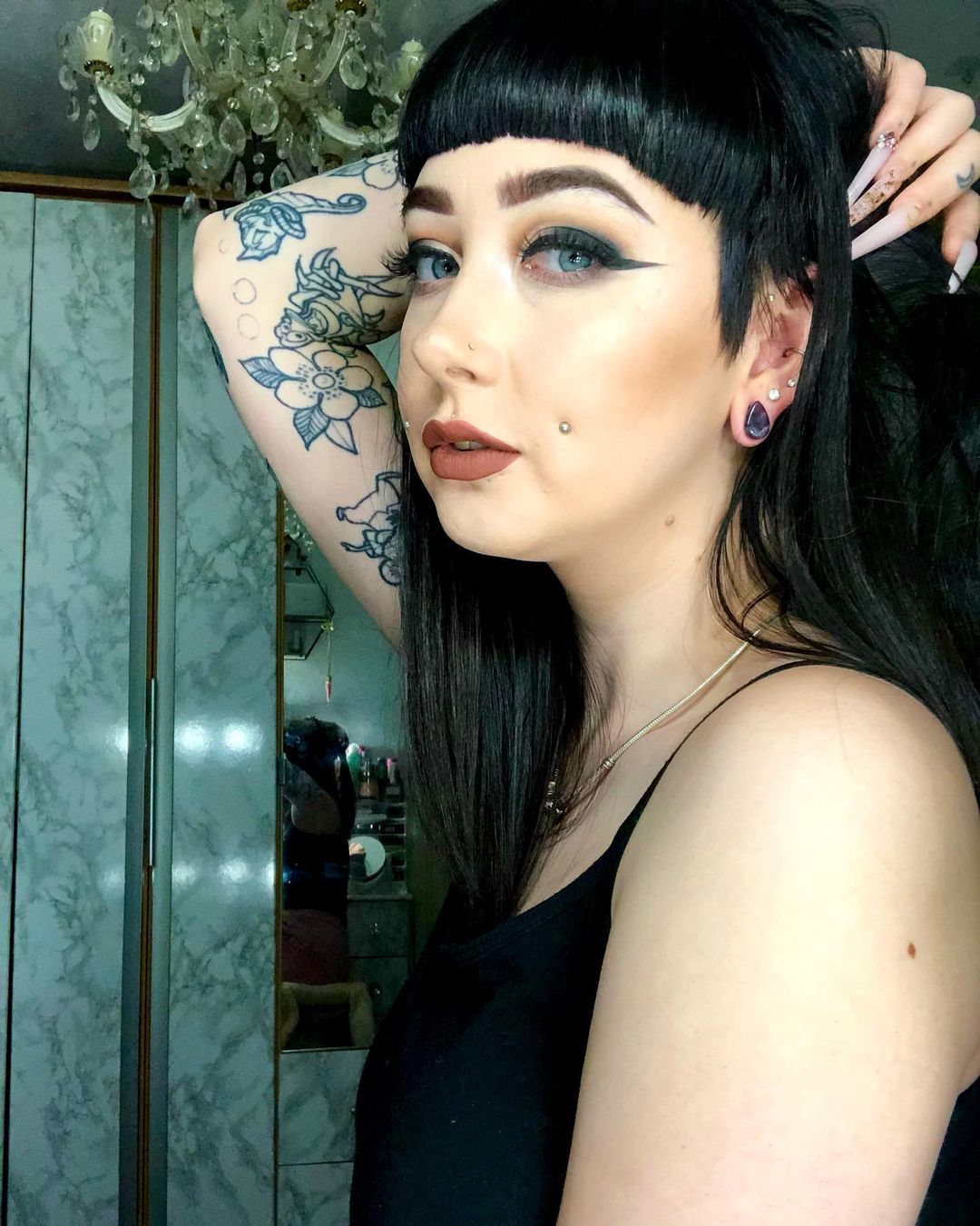 Girl wearing small  Teardrop Amethyst Stone Plug / Gauge