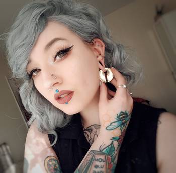 Girl wearing cute Brass Circular Keyhole Ear Weights - Pair