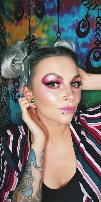 Girl wearing unique Infinity Dichroic Glass Plug / Gauge