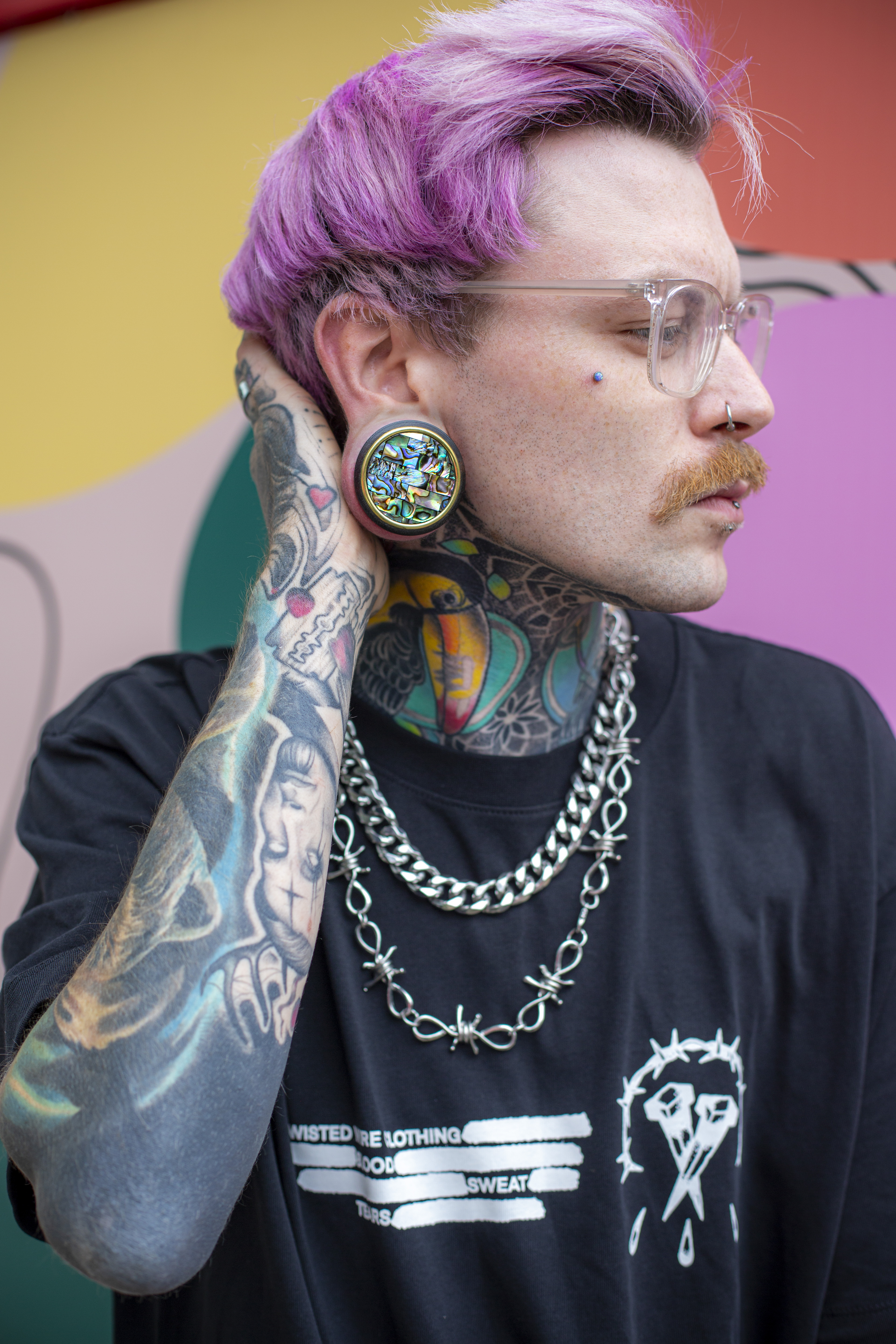 guy wearing big  Gold Mosaic Abalone Wood Ear Plug / Gauge