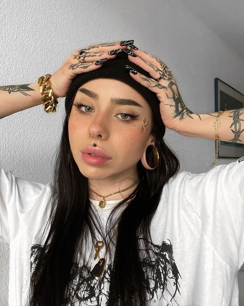 Female wearing unique  Gold Double Flare Stainless Steel Tunnel