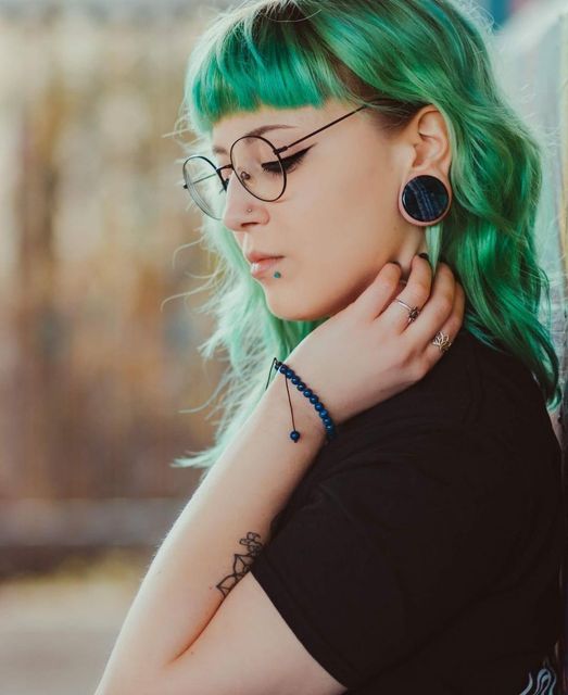 girl wearing pretty  Rainbow Fluorite Stone Plug / Gauge