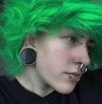 Girl wearing goth Marble Black & Green Stone Plug / Gauge