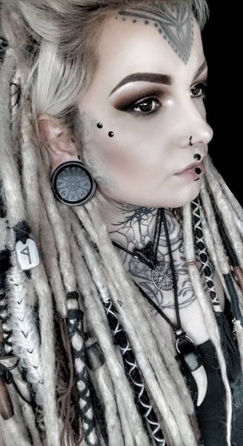 Girl wearing pretty Black Steel Bat Ear Weights - Pair