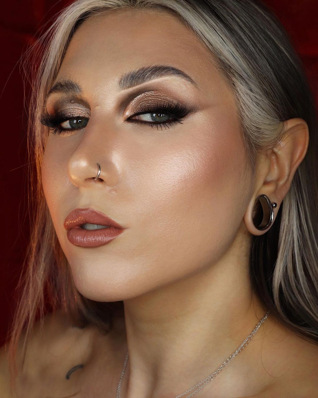 Girl wearing unique  Silver Steel Teardrop Tunnel / Plug / Gauge