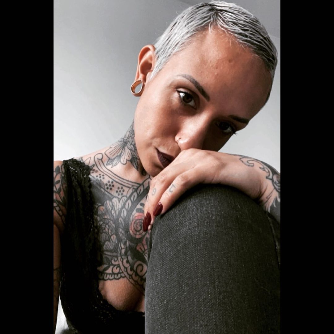Woman wearing small  Gold Steel Teardrop Tunnel / Plug / Gauge