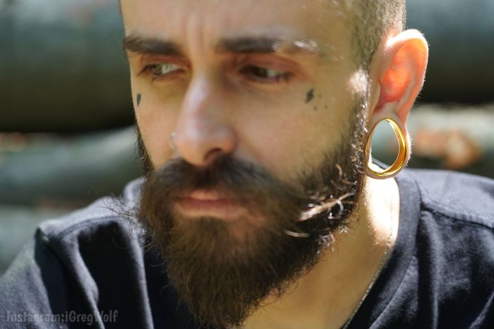 Man wearing big  Gold Steel Teardrop Tunnel / Plug / Gauge