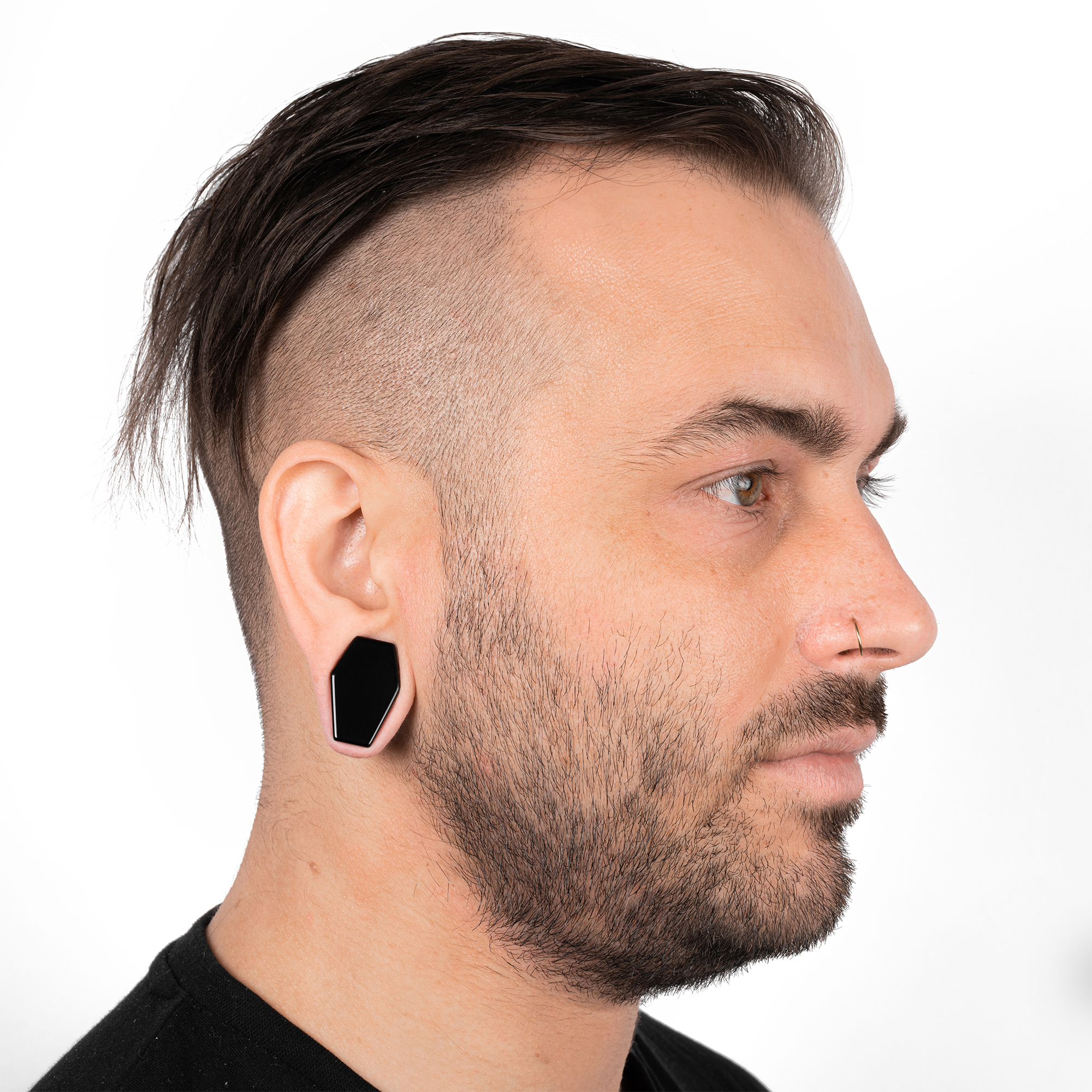 Man wearing large  Black Coffin Glass Plug / Gauge