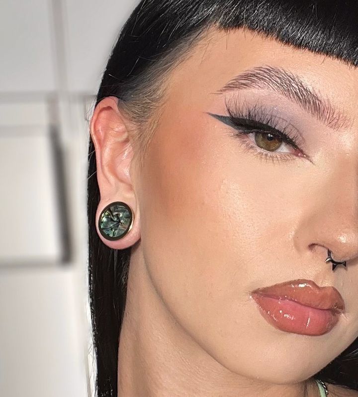 Girl wearing pretty  Abalone Inlay Heavy Brass Metal Ear Gauge / Plug