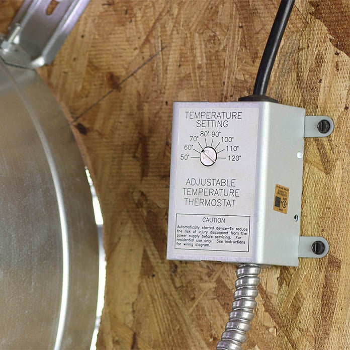 Close-up of the adjustable thermostat pre-wired to the attic fan.