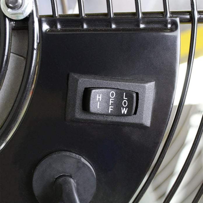 Close-up of the rocker switch which controls the function of the high, off, and low speed selections.