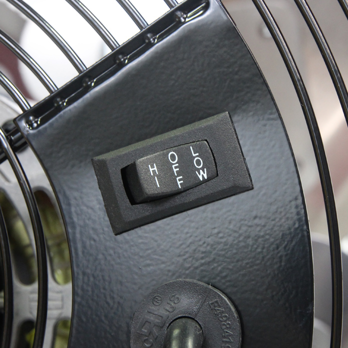 Close-up view of the rocker switch which controls the high, off, and low speed selections.