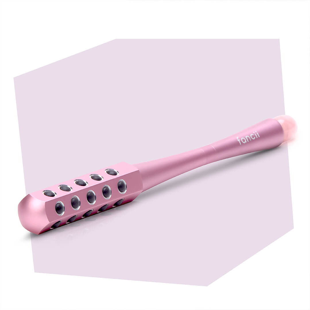 Remi facial massager wand in pink by Fancii and Co