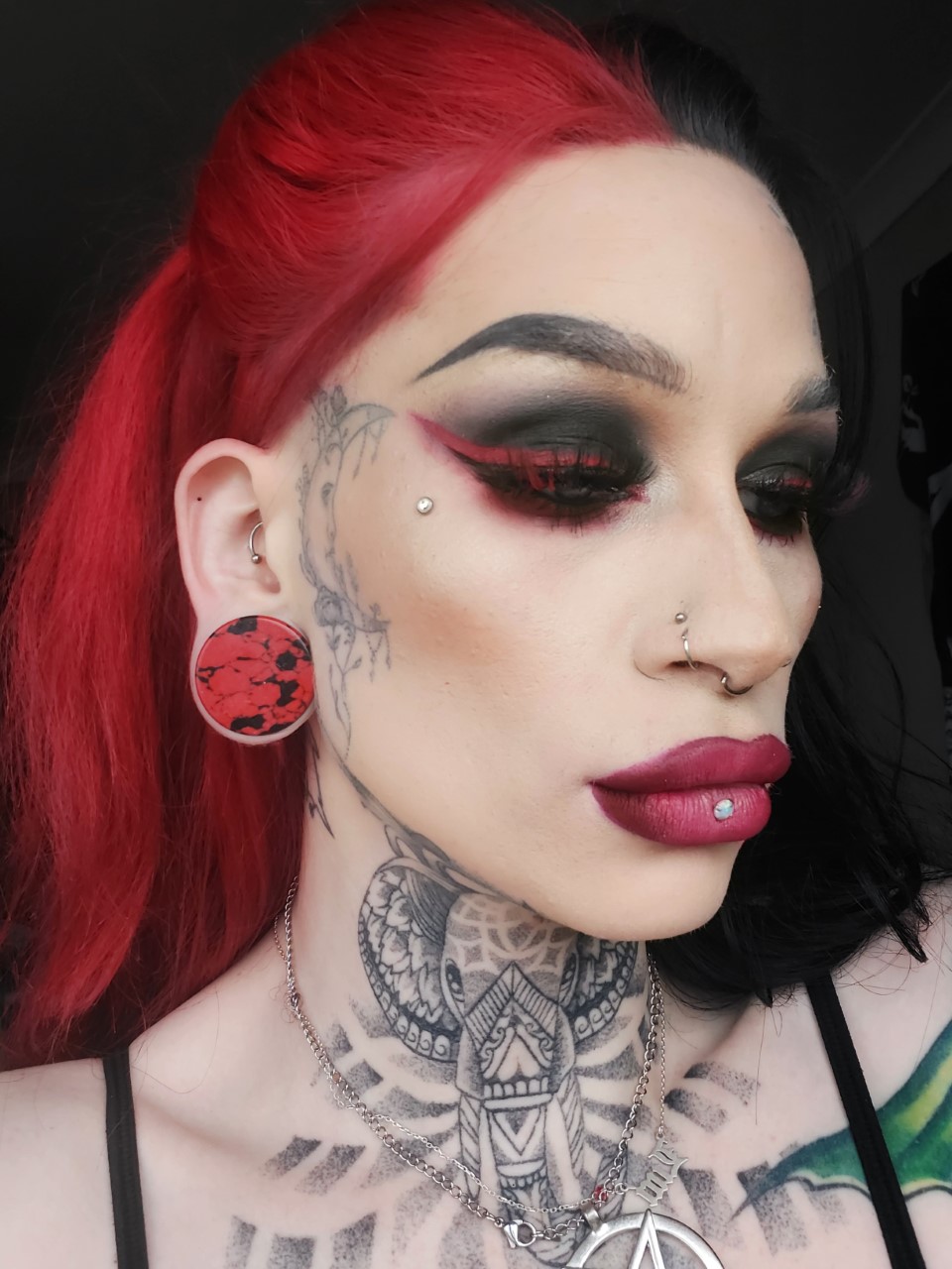 Girl wearing unique  Marble Black & Red Stone Plug / Gauge