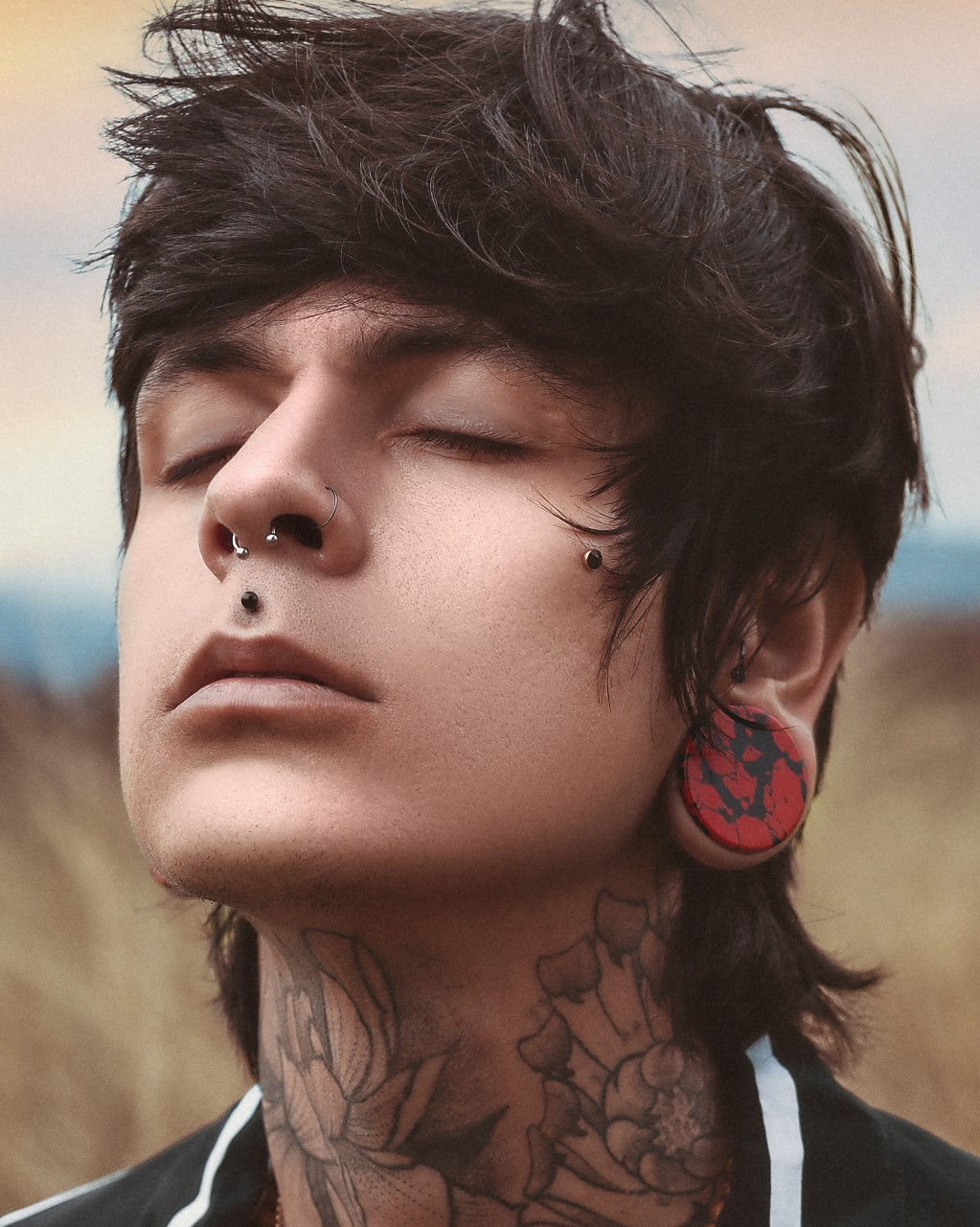 Guy wearing cool Marble Black & Red Stone Plug / Gauge