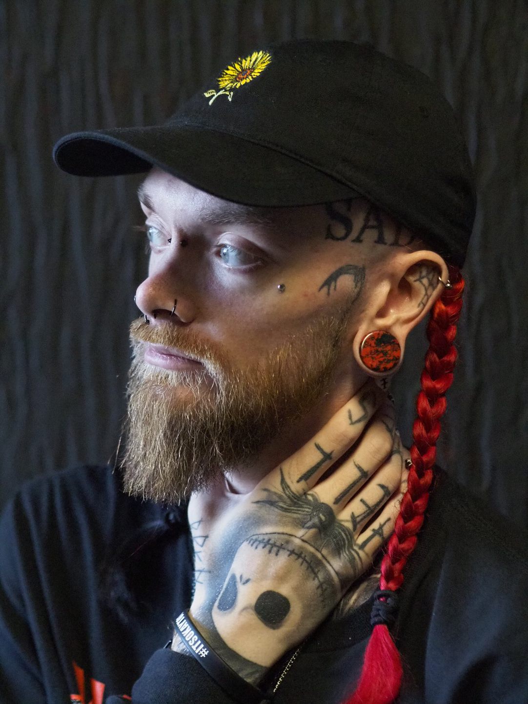 Man wearing nice  Marble Black & Red Stone Plug / Gauge