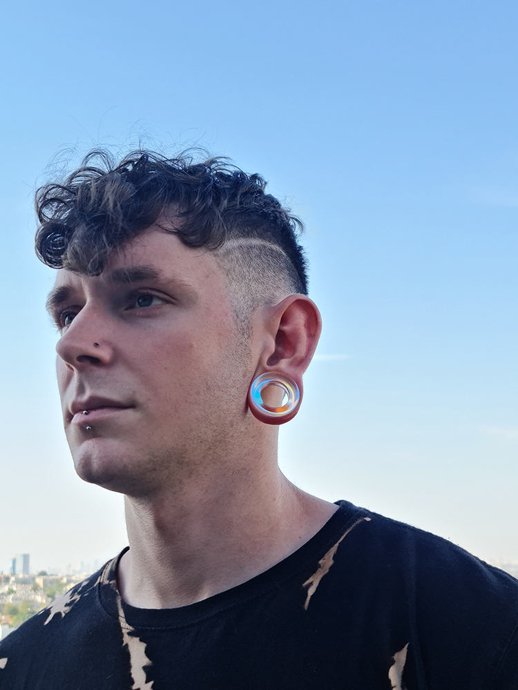 Guy wearing big  Blue & Green Iridescent Glass Ear Tunnel