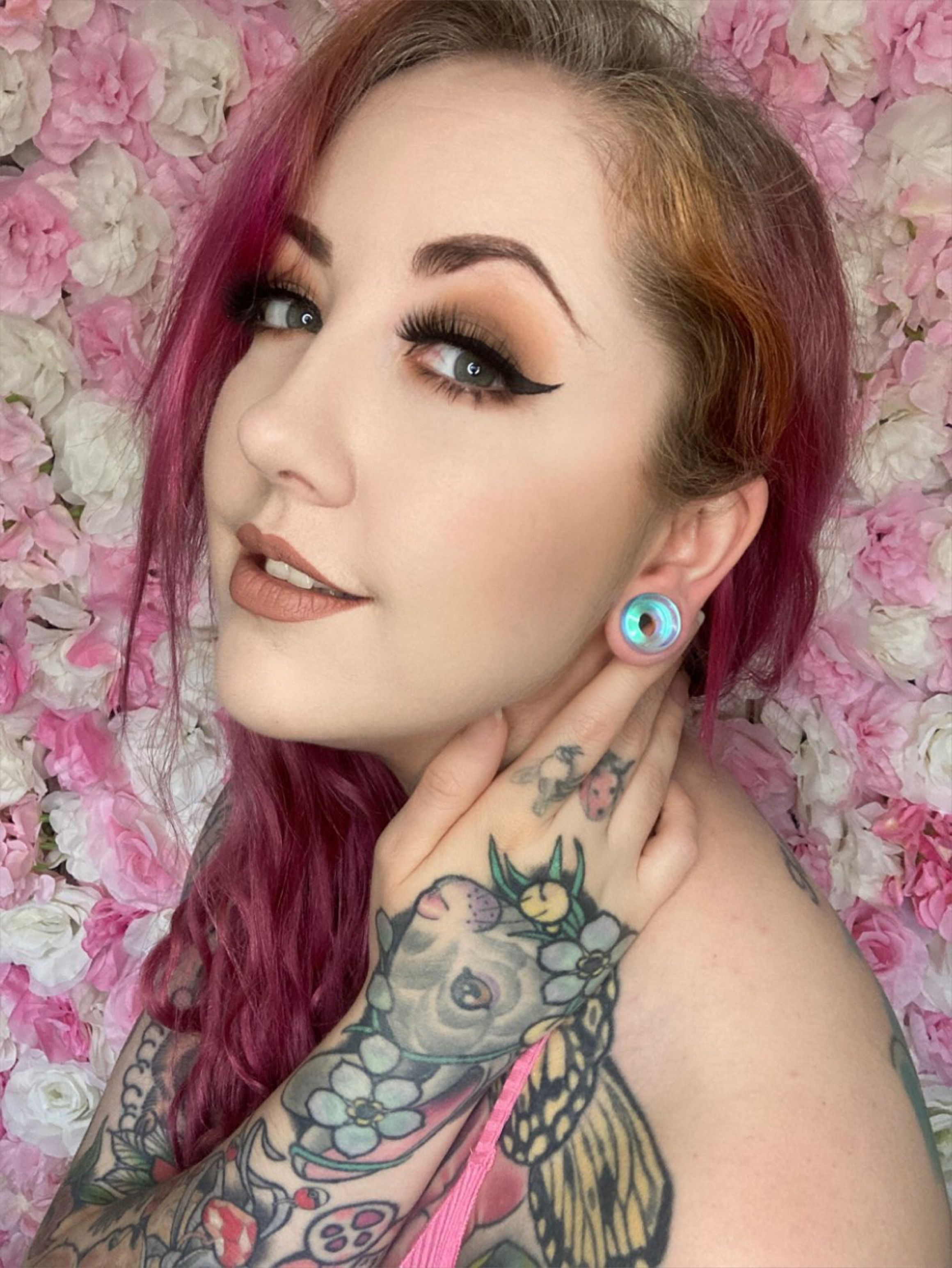 Girl wearing small  Blue & Green Iridescent Glass Ear Tunnel