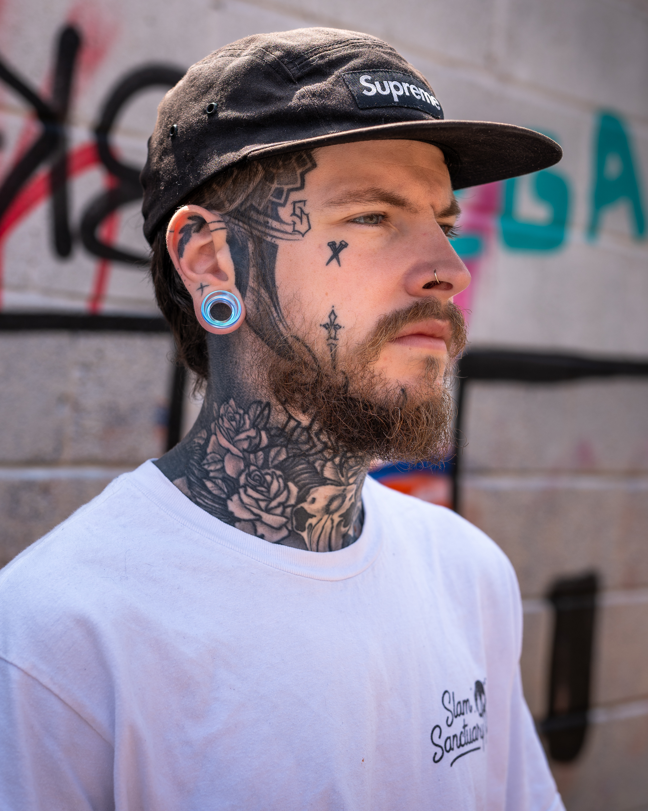 Guy wearing cool  Blue & Green Iridescent Glass Ear Tunnel