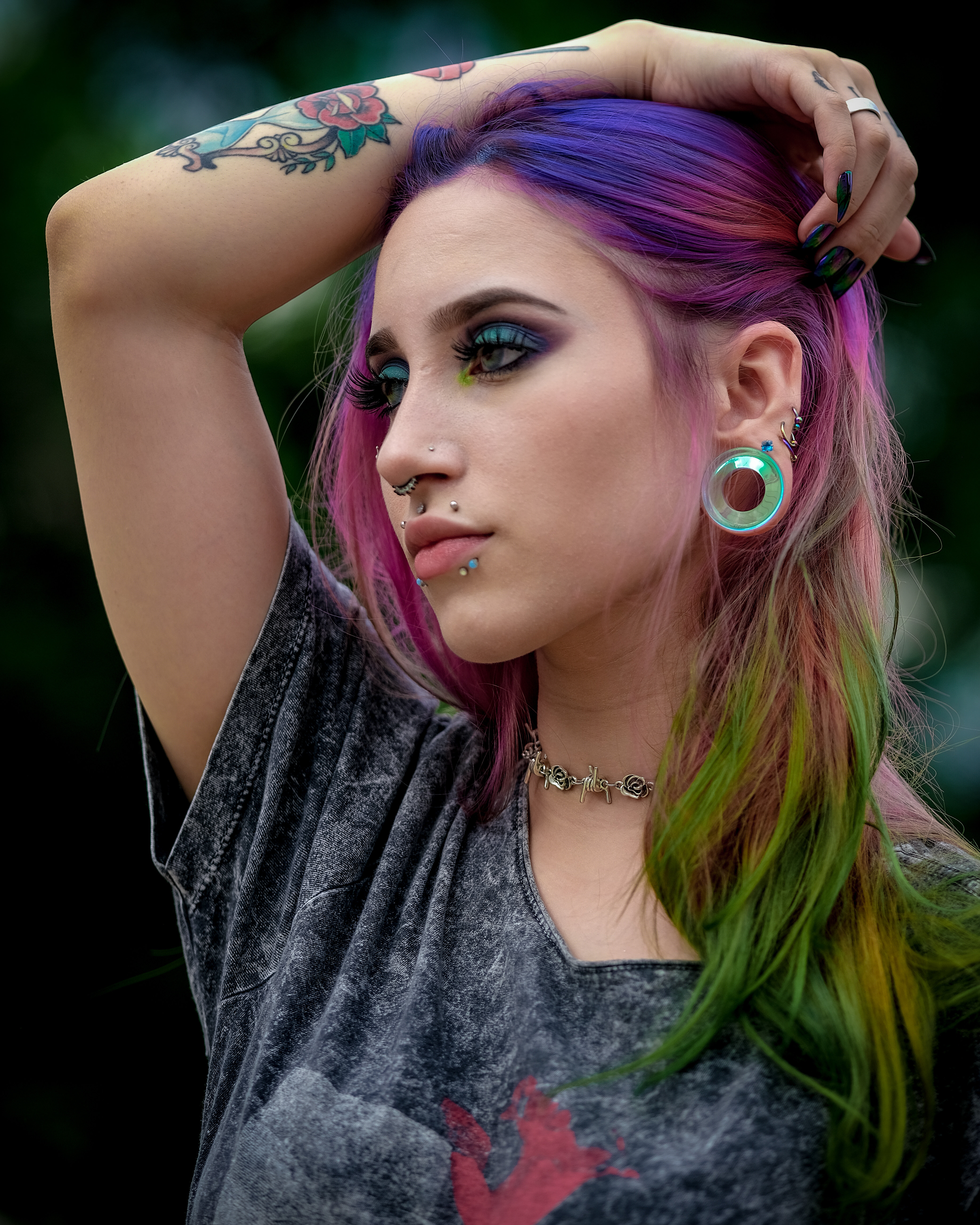 Girl wearing cute  Blue & Green Iridescent Glass Ear Tunnel