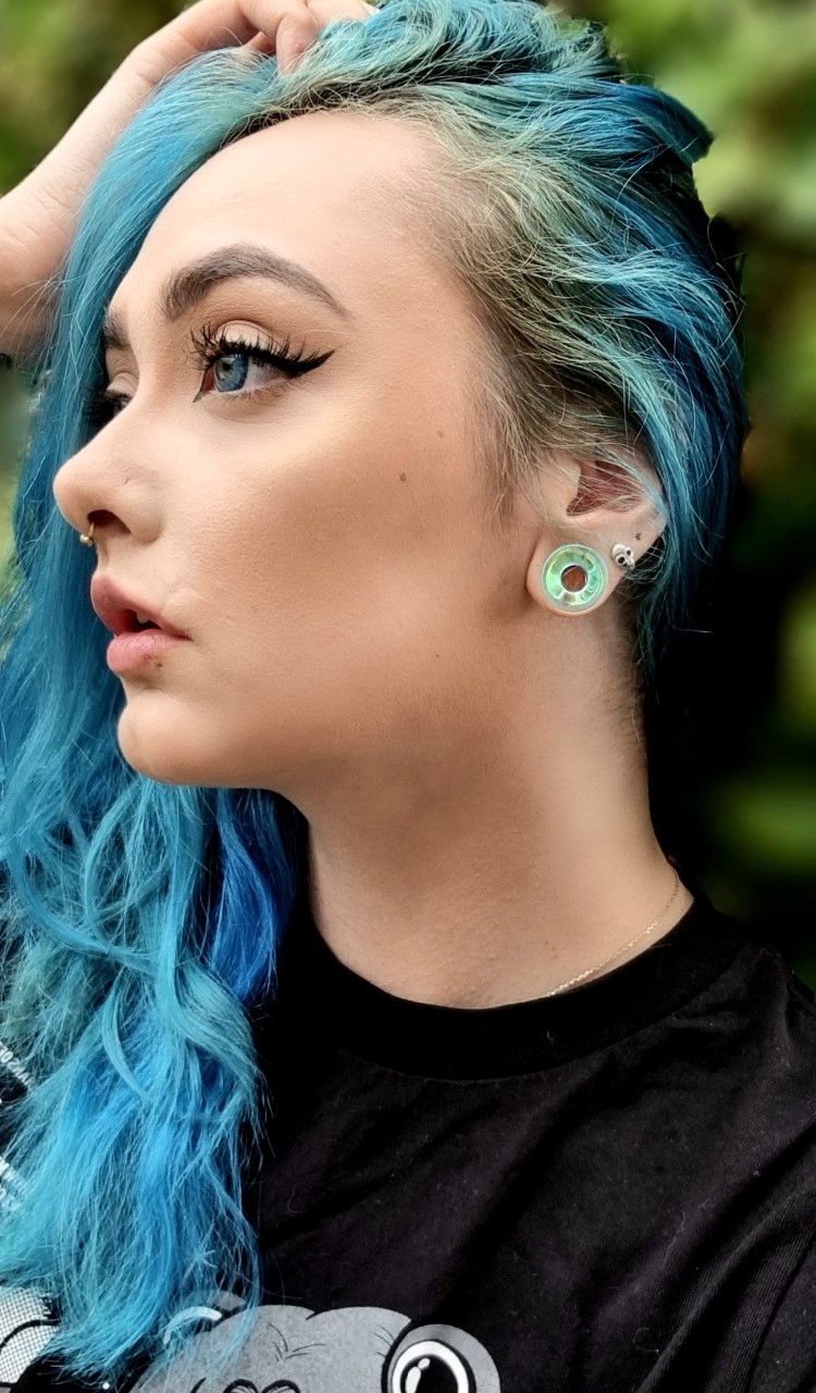 Girl wearing Beautiful  Blue & Green Iridescent Glass Ear Tunnel