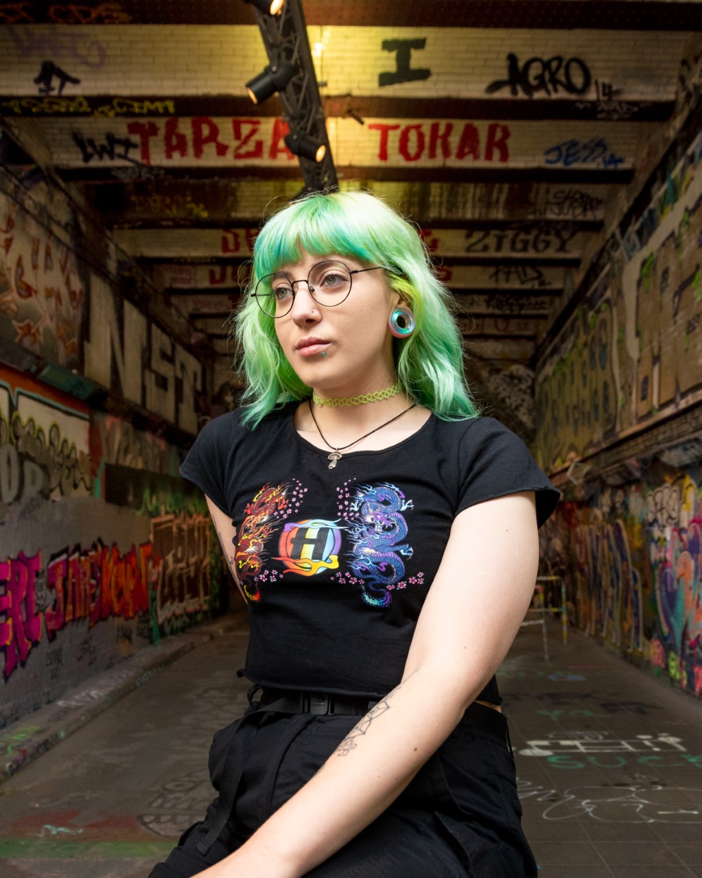 Girl wearing emo  Blue & Green Iridescent Glass Ear Tunnel