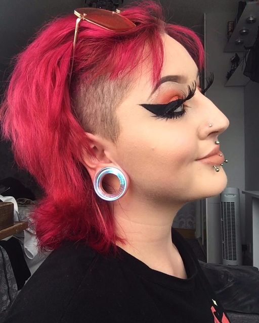Girl wearing goth  Blue & Green Iridescent Glass Ear Tunnel