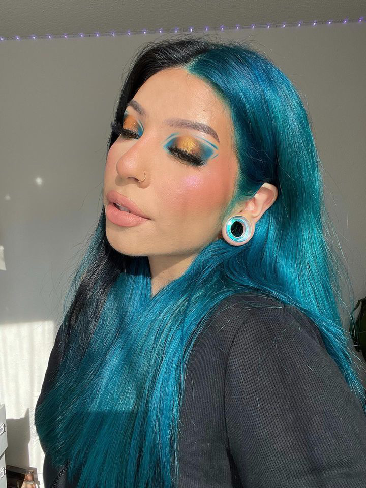 Women wearing cute  Blue & Green Iridescent Glass Ear Tunnel