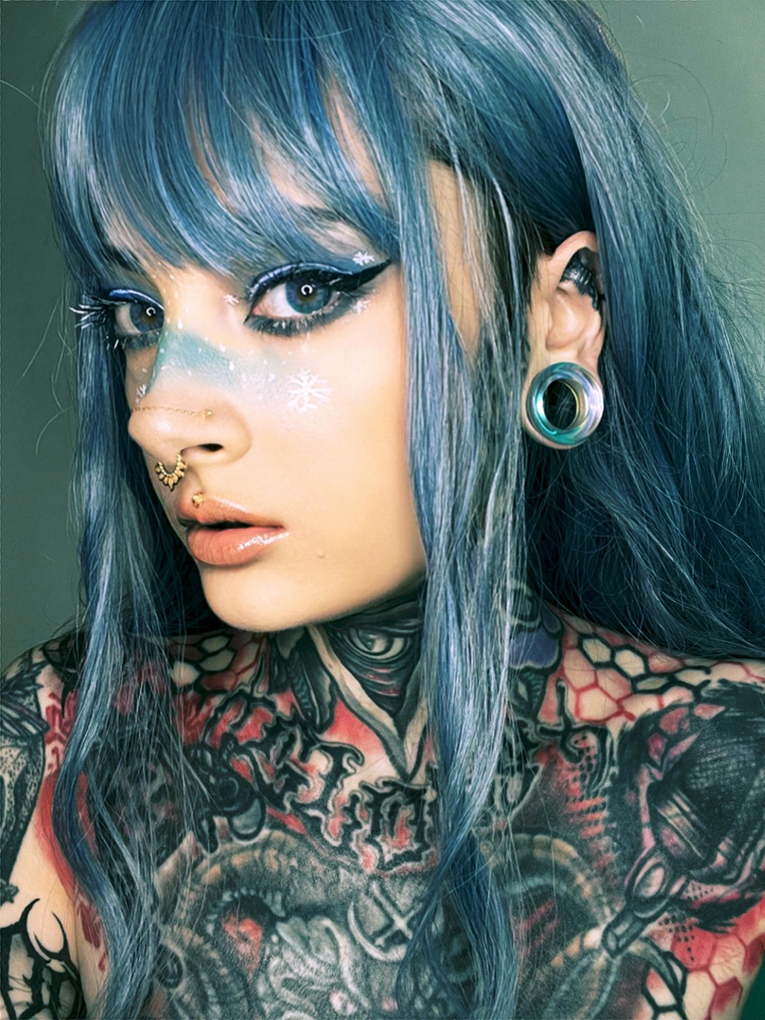Women wearing large Blue & Green Iridescent Glass Ear Tunnel