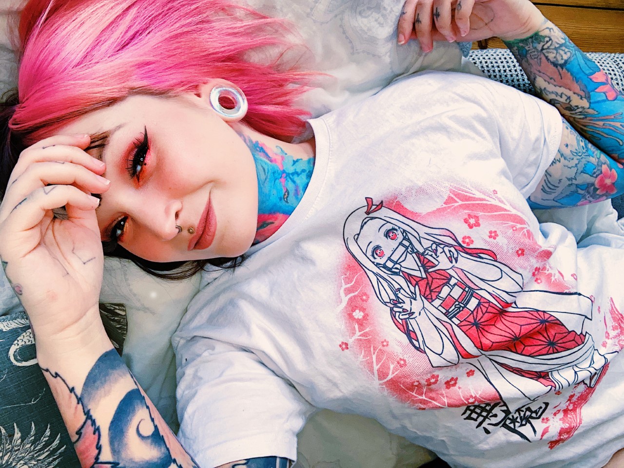 girl wearing colourful  Blue & Green Iridescent Glass Ear Tunnel