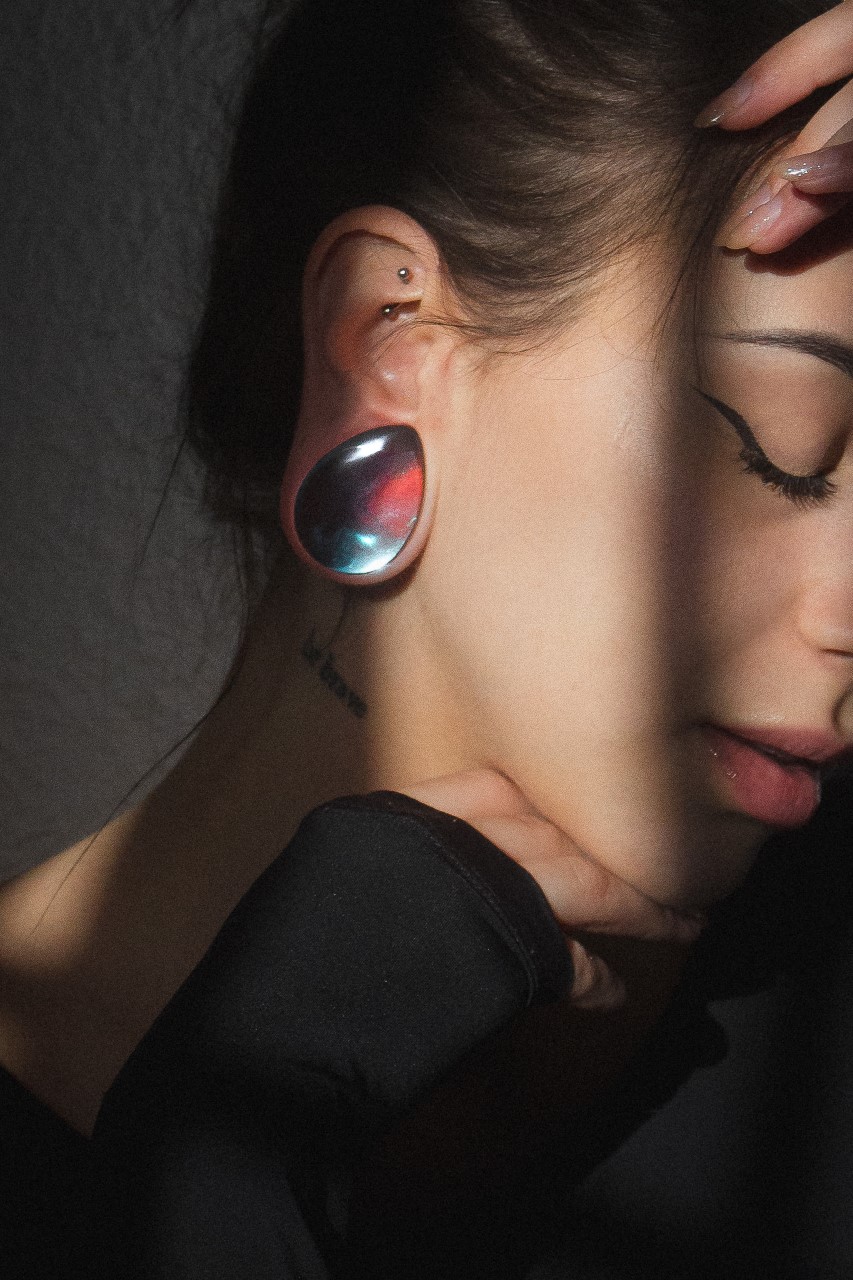 Girl wearing unique Blue & Green Iridescent Teardrop  Glass Plug / Gauge