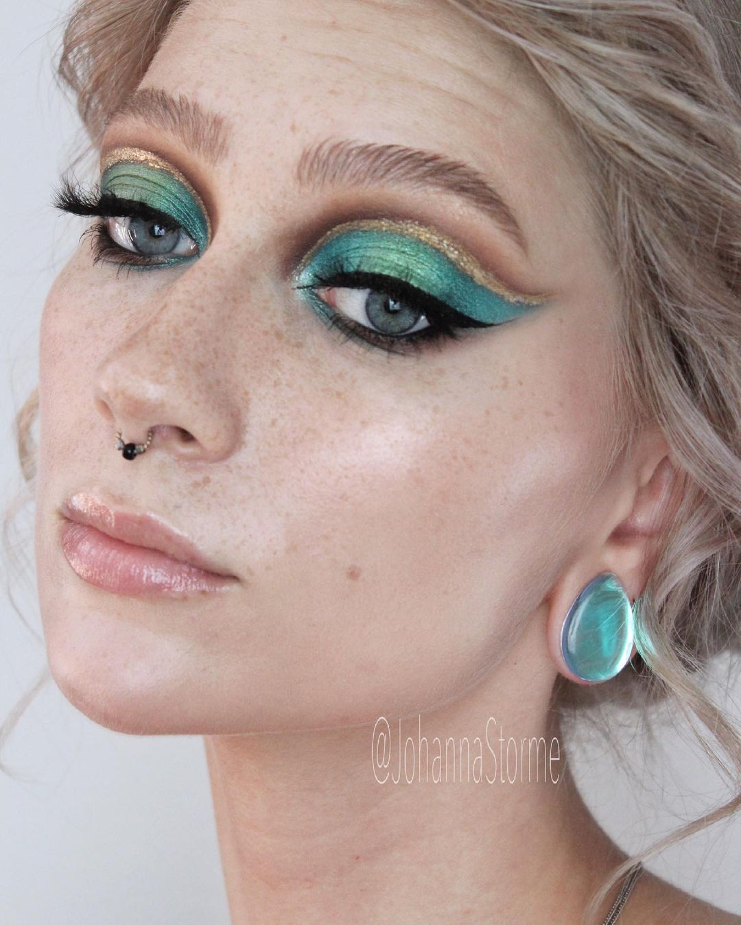 Girl wearing pretty  Blue & Green Iridescent Teardrop  Glass Plug / Gauge