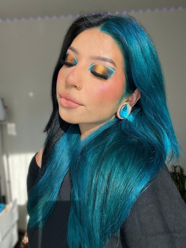 Girl wearing cute  Blue & Green Iridescent Teardrop  Glass Plug / Gauge