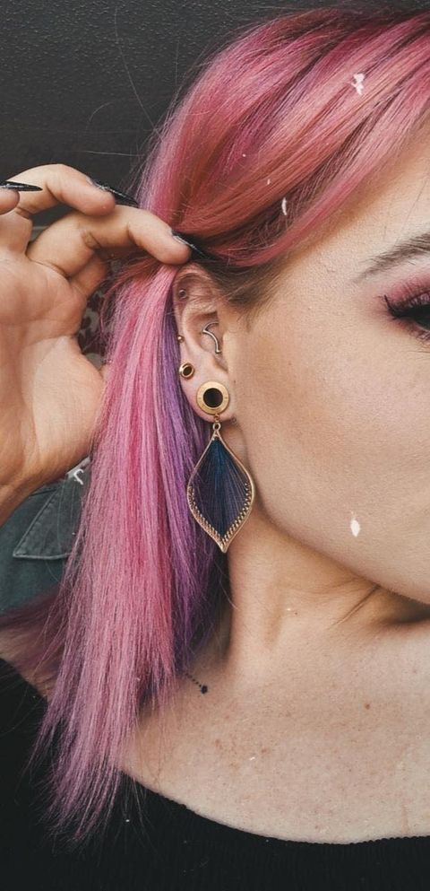 Female wearing cool  Blue & Gold Steel Dangle Feather Plug / Tunnel / Gauge