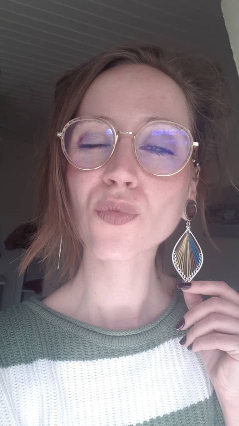 Female wearing nice  Multicoloured Silver Steel Dangle Feather Plug / Tunnel / Gauge