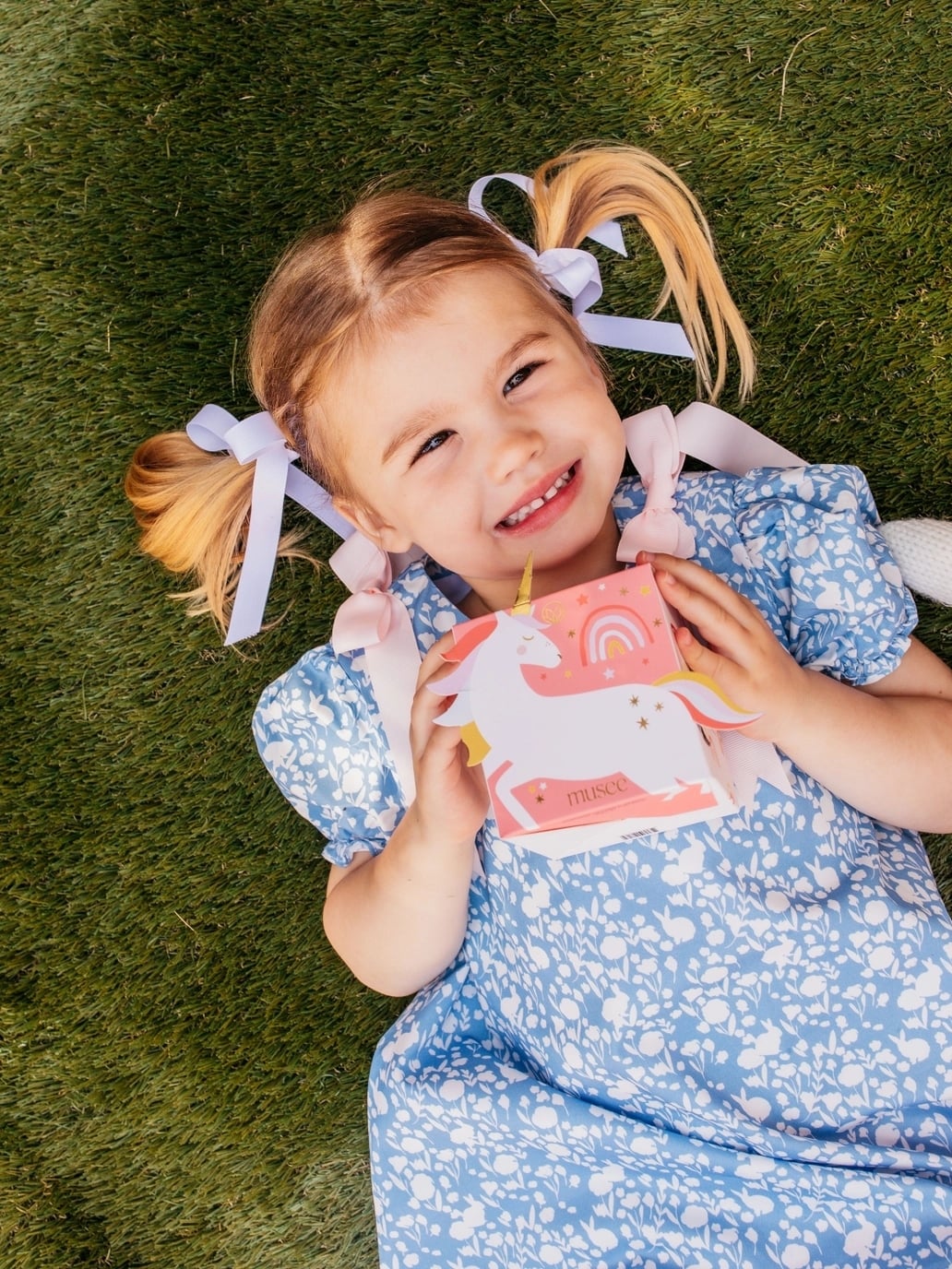girl holding unicorn bath bomb