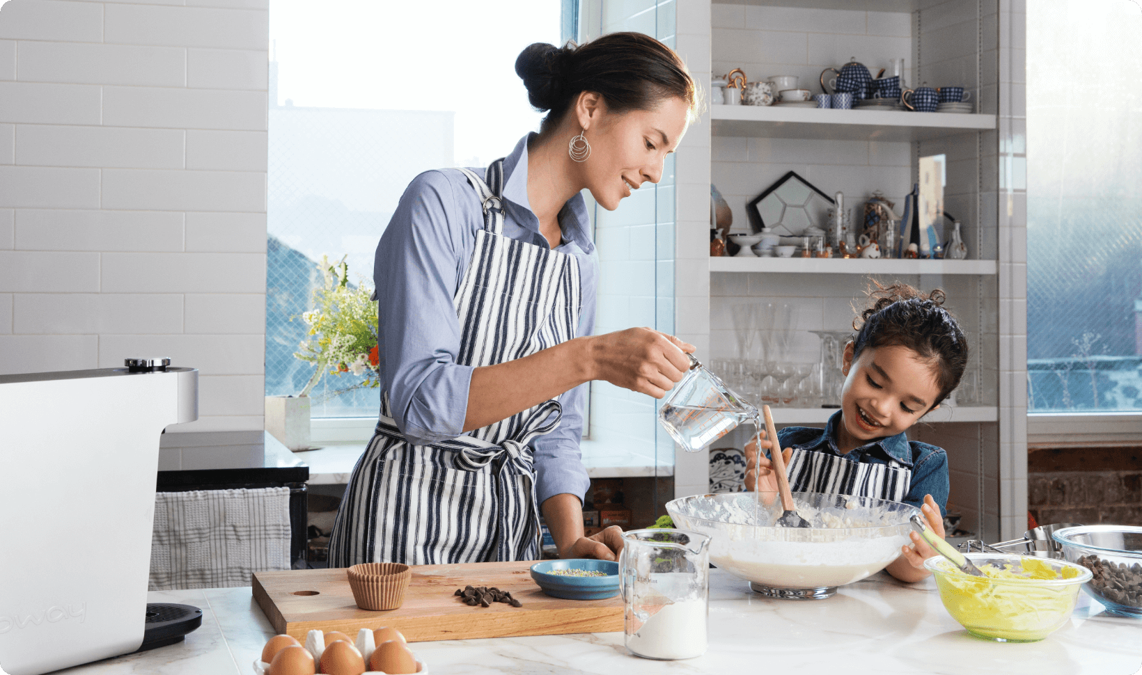 Mother and Daughter using Aquamega purified water to cook