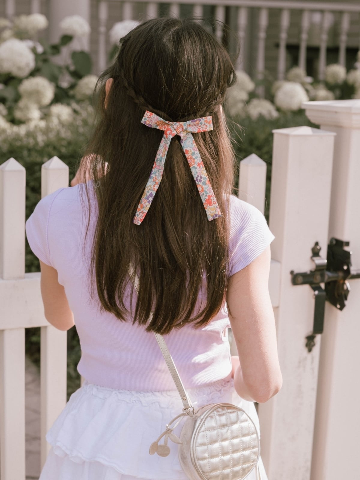 young girl with livy lou bow in her hair
