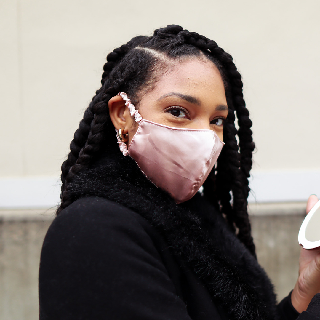 Woman wearing the Fancii reusable face mask in dusty rose