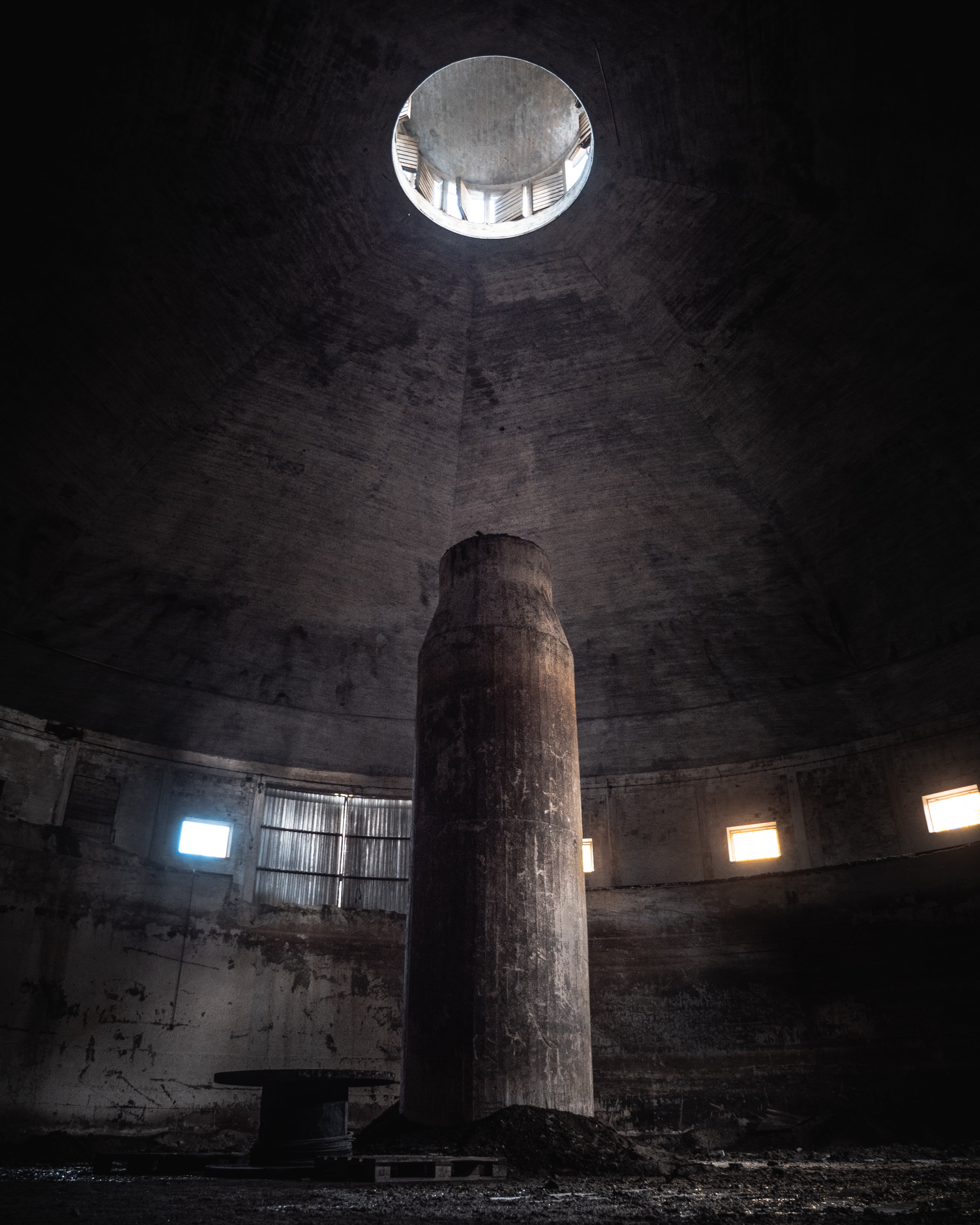 Empty silo. Light from the ceiling shining down.