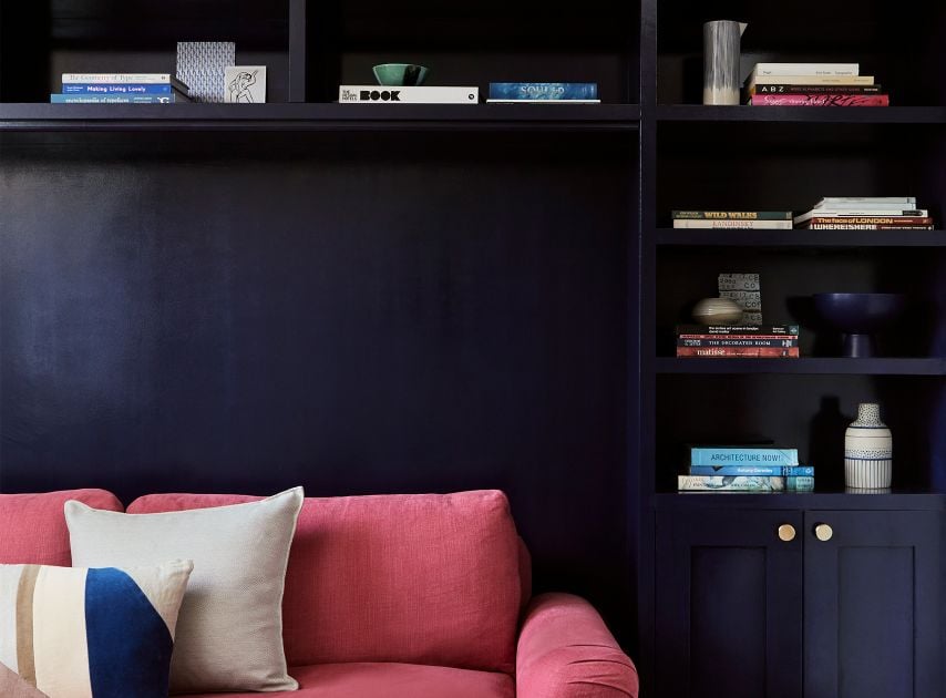 Deep blue purple shelves in front of a pink sofa, painted with Blueprint No.50

